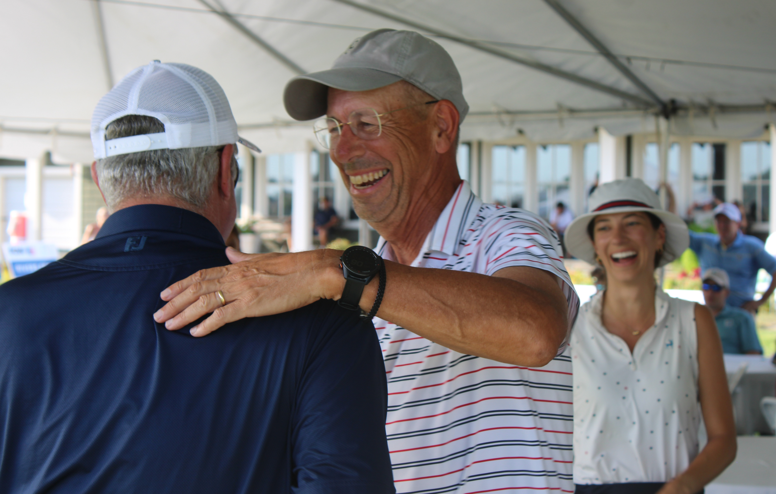 Participants celebrating during Family Golf Week tournament play